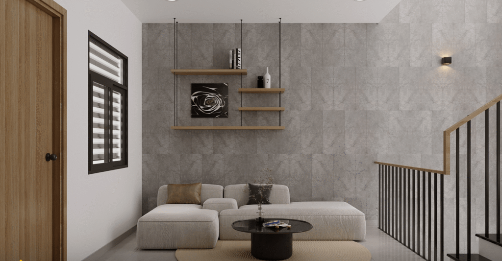 Phòng khách hiện đại với ghế sofa trắng, bàn tròn, và kệ treo trang trí trên tường xám.