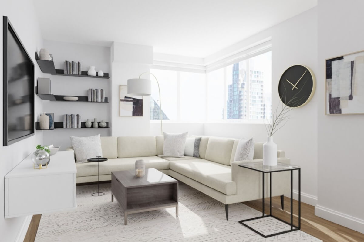 Phòng khách hiện đại với ghế sofa màu kem, bàn cà phê gỗ và đồng hồ treo tường, ánh sáng tự nhiên chan hòa.