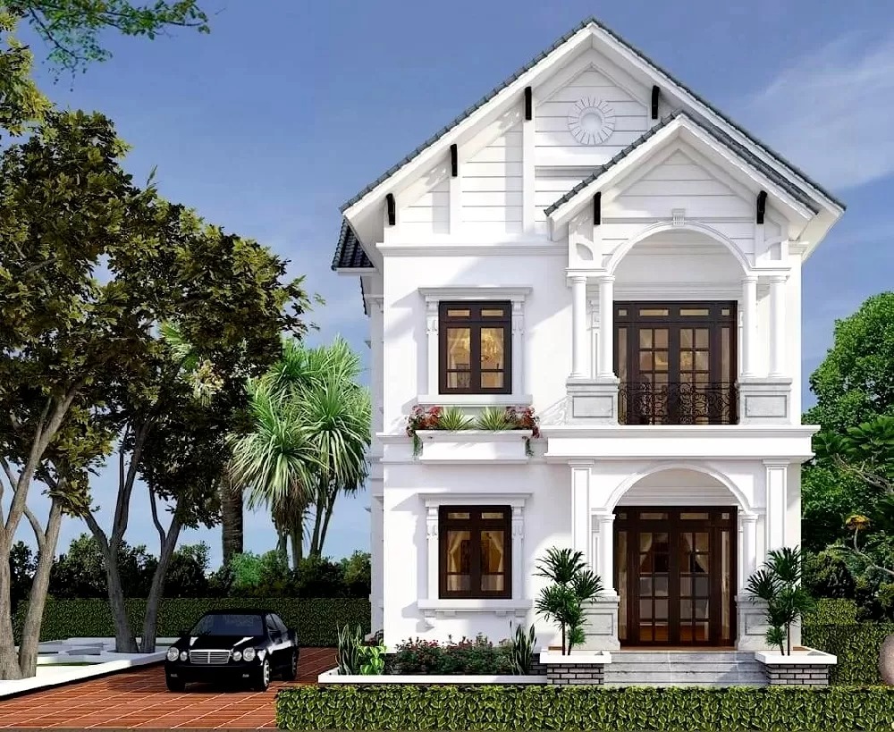 mau-thiet-ke-nha-2-tang-70m2-su-dung-he-mai-thai-chong-am-hieu-qua-2 Nhà hai tầng màu trắng phong cách hiện đại với sân vườn xanh mát và xe hơi đỗ bên cạnh.