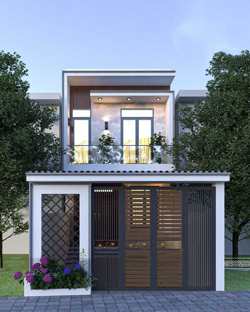mau-thiet-ke-nha-2-tang-70m2-theo-phong-cach-toi-gian-2 Nhà phố hai tầng hiện đại với cửa kính lớn và hàng cây xanh bên ngoài.