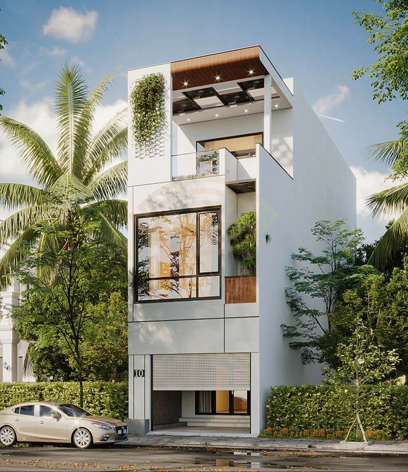 Nhà phố hiện đại 3 tầng xanh mát, có cây xanh và cửa kính lớn, kết hợp thiết kế tối giản và tiện nghi.