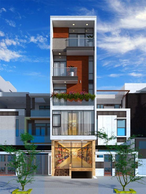 Nhà phố hiện đại với kiến trúc mặt tiền độc đáo, cây xanh trang trí và trời xanh trong nền.