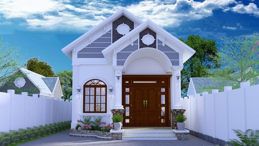 Nhà cấp 4 mái thái hiện đại với cổng gỗ lớn, sơn trắng, vườn cây xanh mát và trời xanh nắng đẹp.