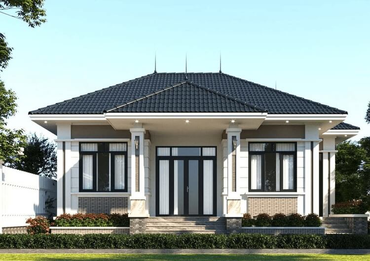 Nhà cấp 4 hiện đại với mái ngói xanh, cửa kính lớn và sân nhỏ trước nhà, thích hợp cho gia đình trẻ.