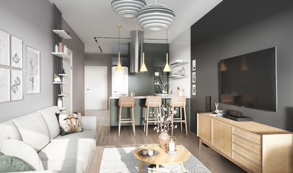 Phòng khách hiện đại với sofa trắng, bàn gỗ và đèn treo trang trí, kệ sách và TV màn hình phẳng.