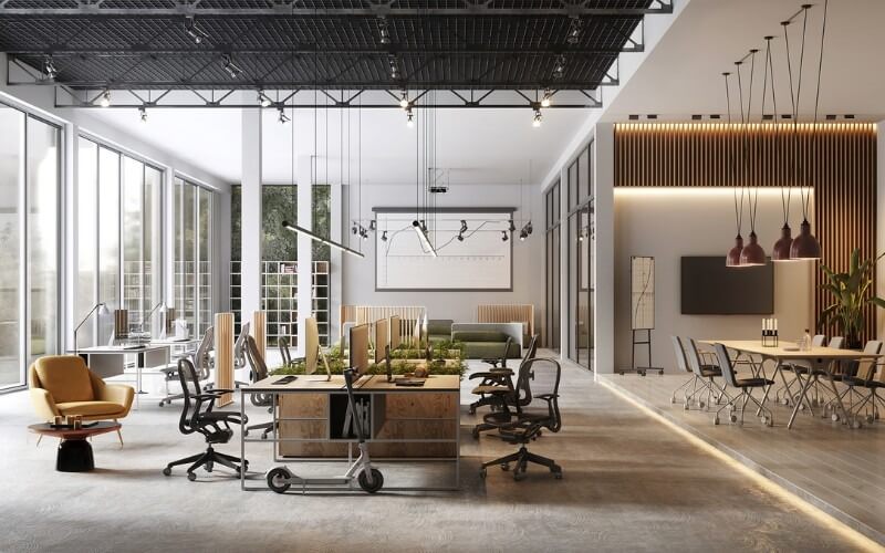 Văn phòng mở hiện đại với bàn làm việc, cây xanh và ánh sáng tự nhiên, tạo không gian làm việc sáng tạo và thoải mái.