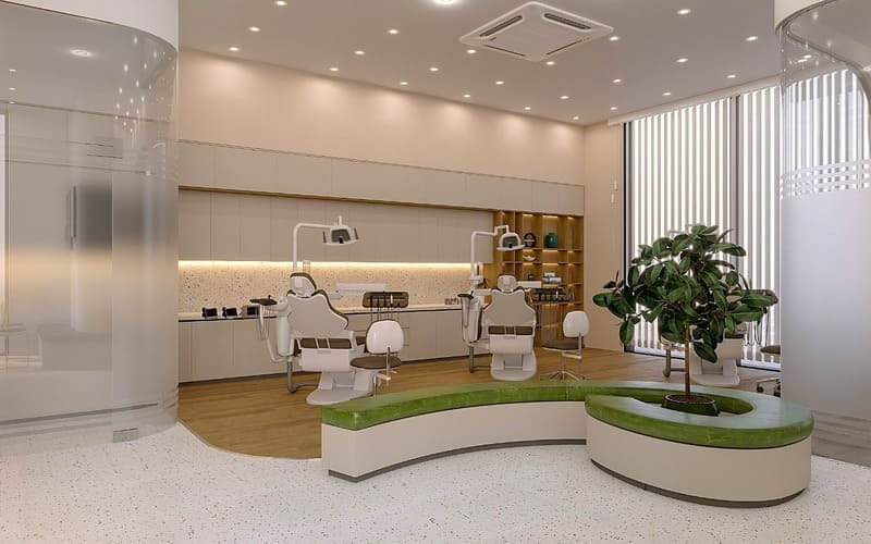 Phòng khám nha khoa hiện đại với ghế ngồi thoải mái, cây xanh trang trí và ánh sáng tự nhiên.