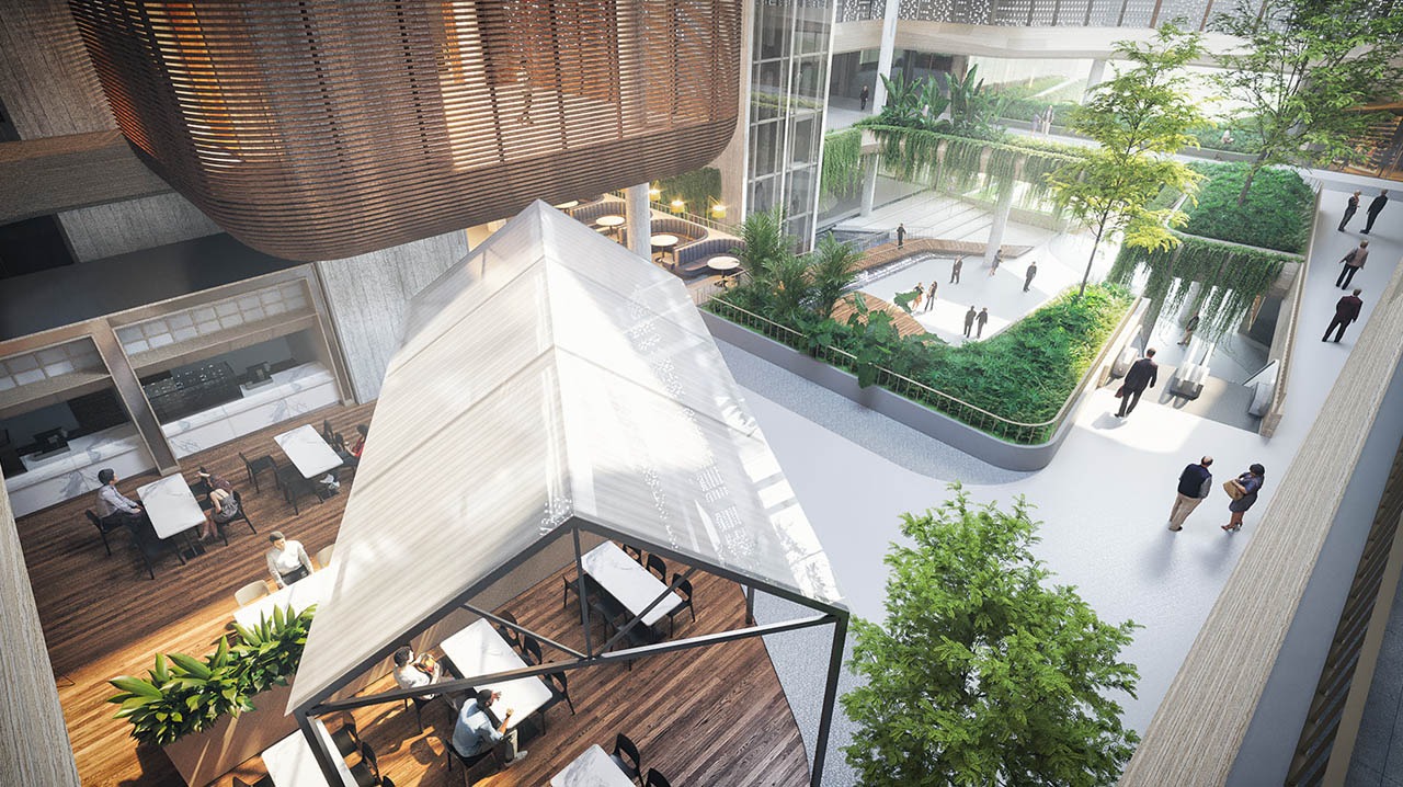 Không gian nội thất xanh với cây cối và ánh sáng tự nhiên, hiển thị khu vực bàn ghế và lối đi.