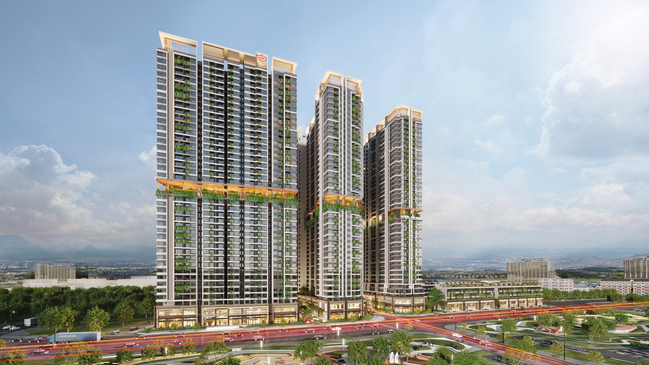 Tòa nhà cao tầng với thiết kế xanh, hiện đại, nằm tại khu đô thị sầm uất dưới bầu trời xanh rộng lớn.