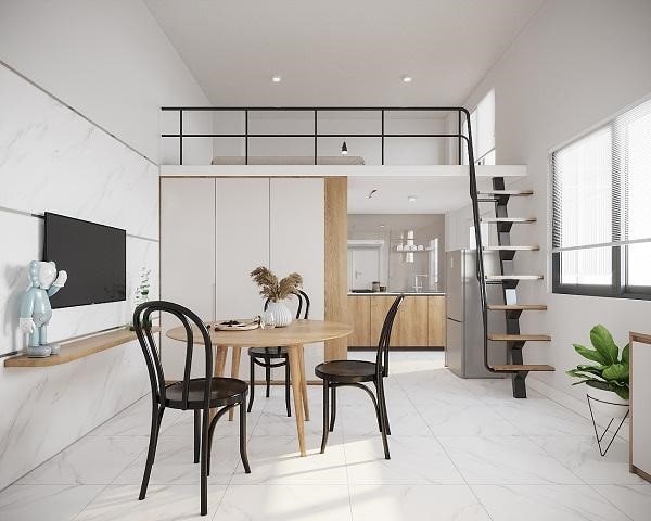 Căn hộ studio nhỏ gọn với gác lửng, bàn ăn gỗ và cầu thang tối giản trong không gian nội thất hiện đại.