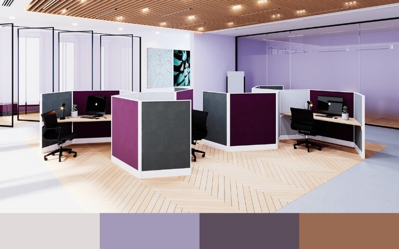 Văn phòng hiện đại với vách ngăn màu tím và xám, ánh sáng tự nhiên, ghế xoay và máy tính trên bàn làm việc.