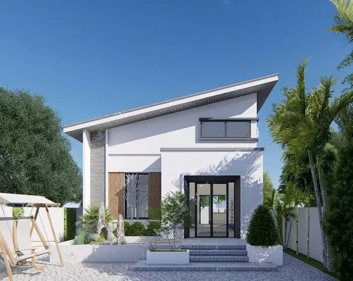 Nhà hiện đại một tầng, mái dốc, nằm giữa vườn cây xanh, trời nắng đẹp.