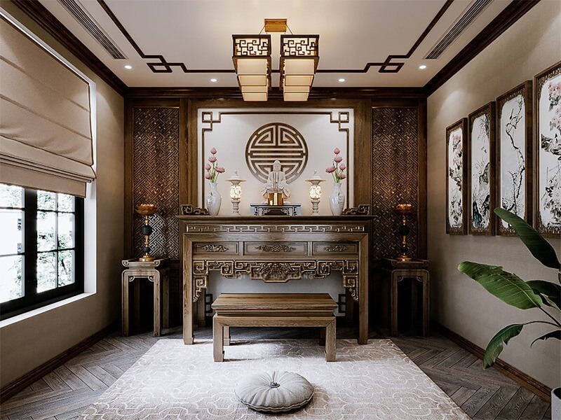 Phòng thờ trang trí cổ điển, bàn thờ gỗ chạm trổ, tranh tường, đèn trang trí, ánh sáng tự nhiên qua cửa sổ.