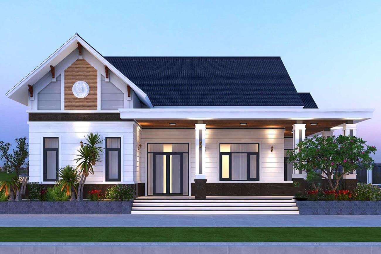 Ngôi nhà một tầng hiện đại với mái ngói đen, tường trắng và vườn cây xanh mát trước sân.