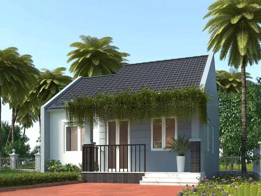Nhà nhỏ hiện đại với mái ngói xanh, trước hiên trồng cây xanh, bao quanh là cây cọ cao, nền trời xanh.