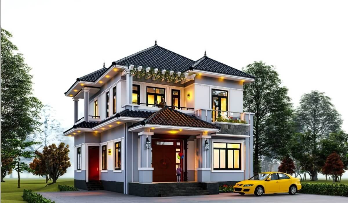 Ngôi nhà hai tầng hiện đại với mái ngói, ánh sáng nổi bật và xe hơi vàng đỗ ngoài sân, bao quanh bởi cây xanh.