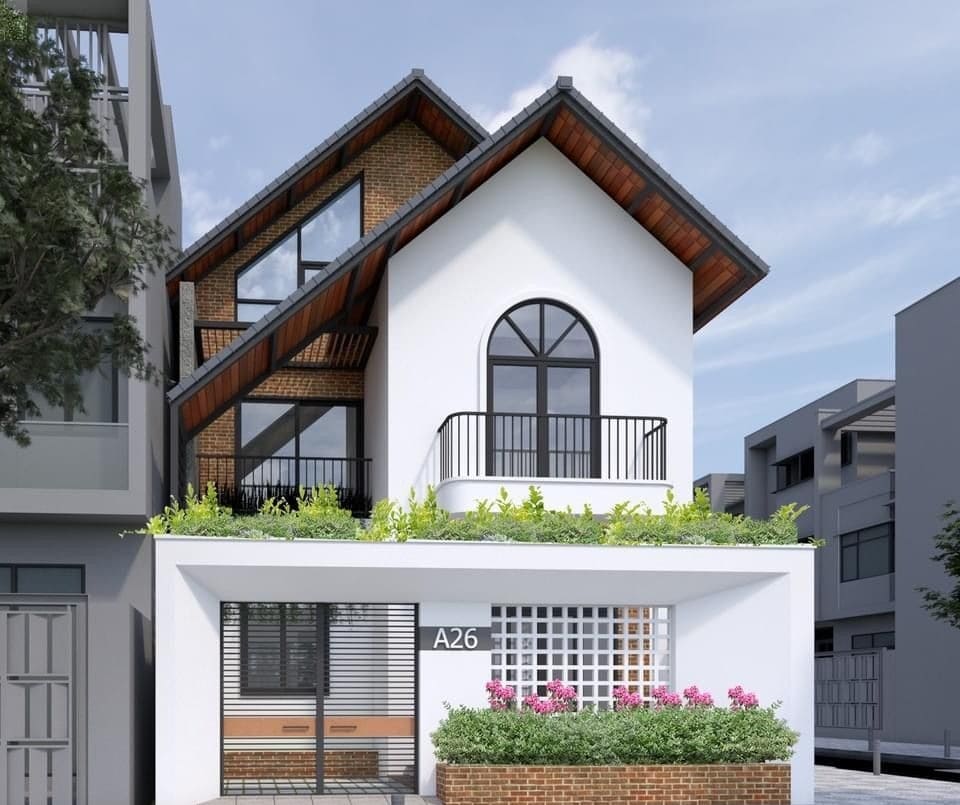 nha-may-lech-2-tang-6 Mẫu nhà phố 2 tầng hiện đại, mái chéo, cửa sổ kính lớn, ban công cây xanh, mặt tiền gạch và sơn trắng.