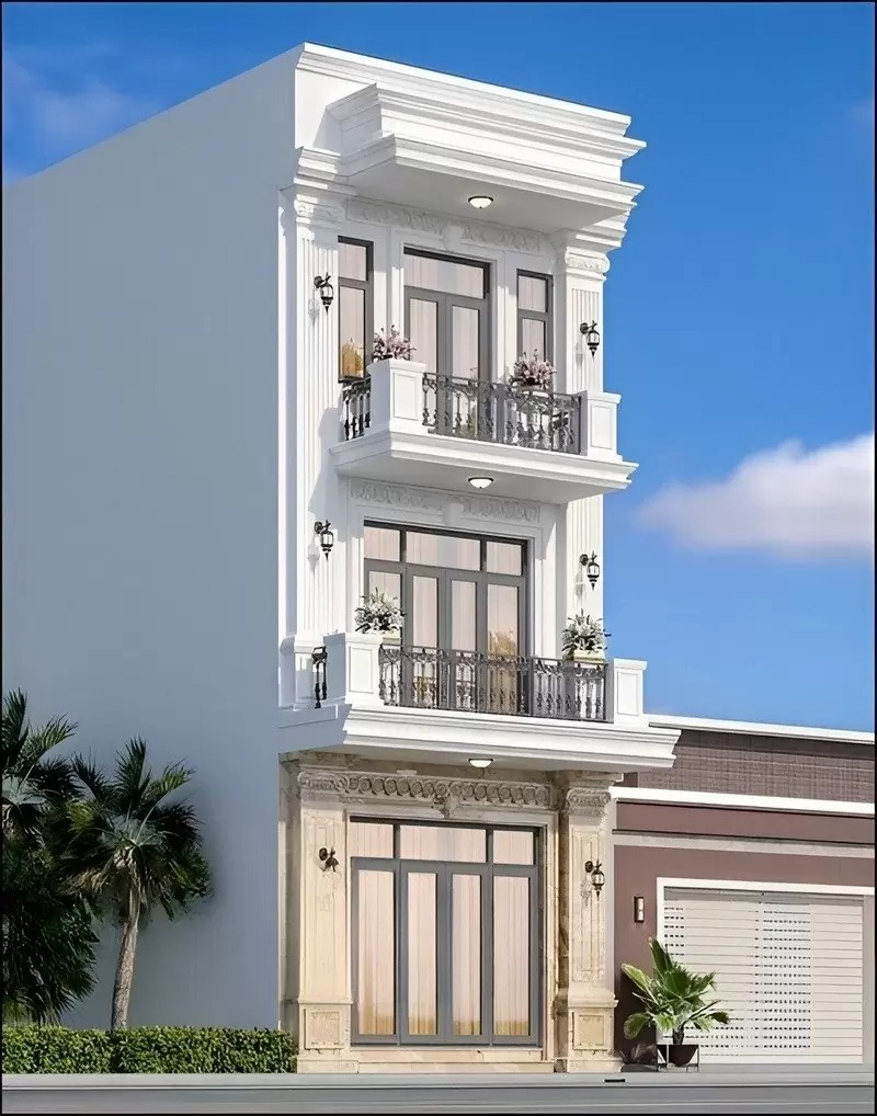 Tòa nhà kiểu cổ điển 3 tầng với ban công và cửa kính lớn, kiến trúc tinh tế, trời xanh và cây cối xung quanh.