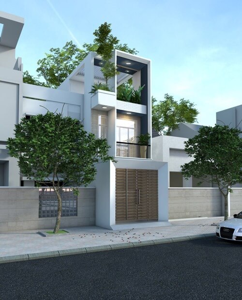 Nhà phố hiện đại với cửa gỗ lớn và cây xanh, thiết kế ba tầng và ban công thoáng đãng, nằm ven đường phố.