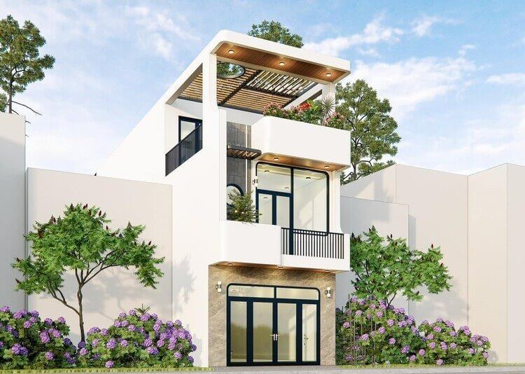 Nhà phố ba tầng hiện đại có ban công và cây xanh xung quanh, thiết kế theo phong cách tối giản.