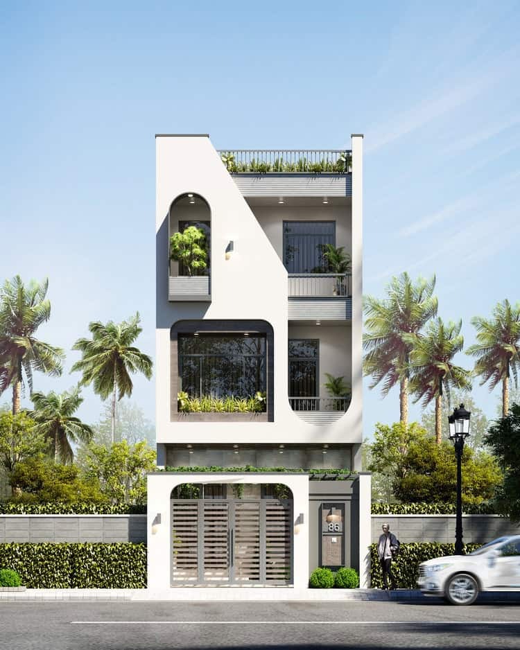 Ngôi nhà hiện đại ba tầng với cây xanh xung quanh, thiết kế mặt tiền sáng tạo và ô tô phía trước.