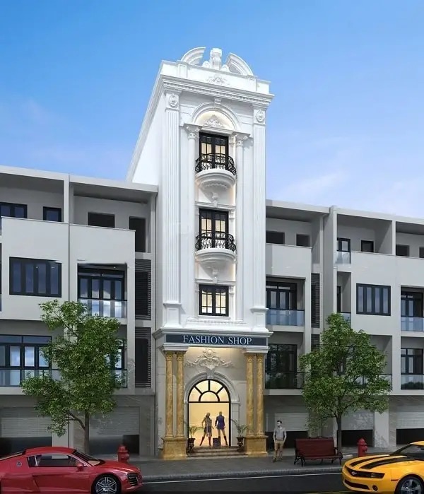 Mặt tiền cửa hàng thời trang hiện đại với kiến trúc sang trọng và cửa sổ lớn, có cây xanh và ô tô phía trước.