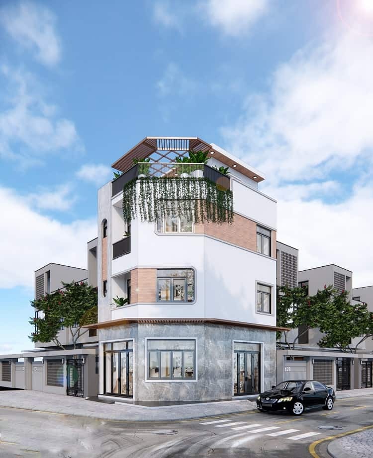 Nhà phố hiện đại ba tầng với cây xanh, nằm ở góc đường, trời xanh nắng nhẹ.
