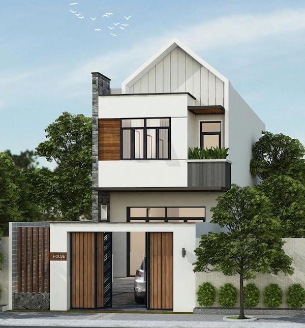 Nhà hiện đại hai tầng với cửa kính lớn, thiết kế mái dốc, cây xanh bao quanh và cổng gỗ sang trọng.