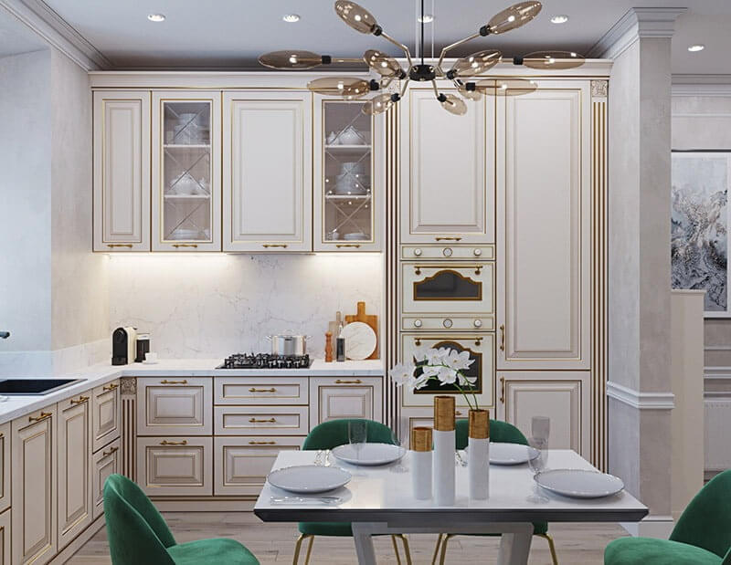 Nhà bếp sang trọng với tủ trắng, đèn hiện đại, bàn ăn và ghế xanh, tạo không gian ấm cúng và thanh lịch.