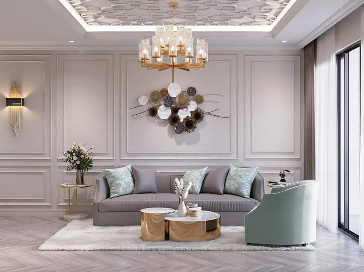Phòng khách hiện đại với sofa xám, đèn chùm sang trọng và trang trí tường nghệ thuật.