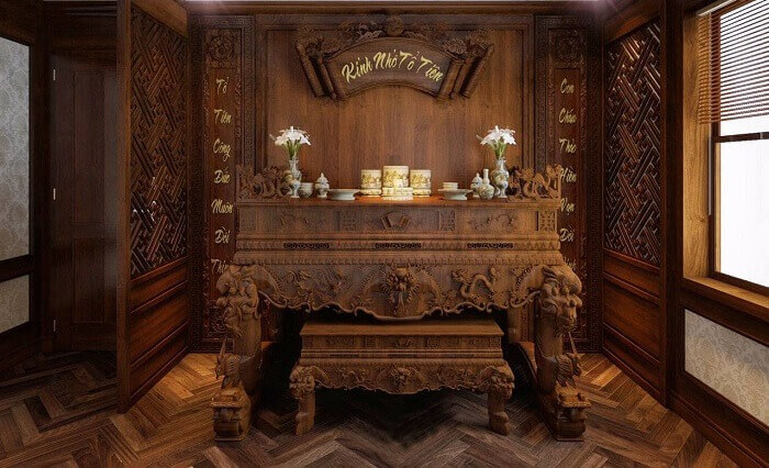 okhc25vxszri9jqabe6m Bàn thờ gỗ cổ điển với bài vị và hoa được trang trí trong phòng trang nghiêm, ánh sáng tự nhiên chiếu qua cửa sổ.