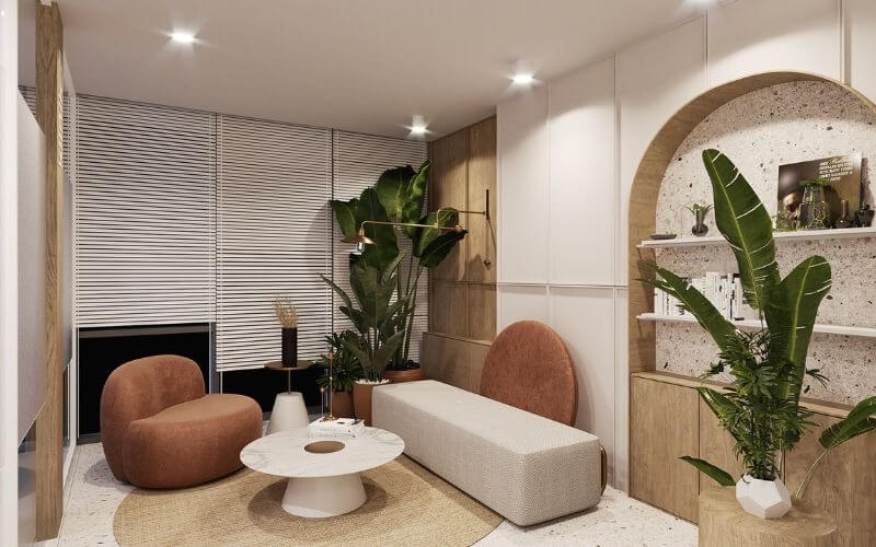 Phòng khách hiện đại với sofa bo tròn, cây xanh, bàn trà trắng và ánh sáng dịu nhẹ.