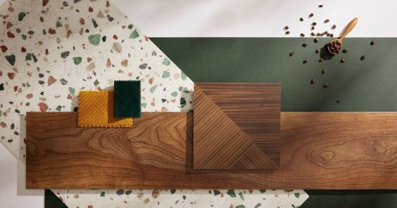 Bố cục mẫu ván gỗ và vải với nền terrazzo và xanh lá, mang lại cảm giác ấm áp và sang trọng.