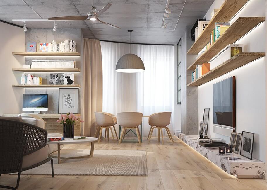 Phòng khách hiện đại với kệ sách, bàn tròn và ghế, ánh sáng tự nhiên từ cửa sổ lớn.