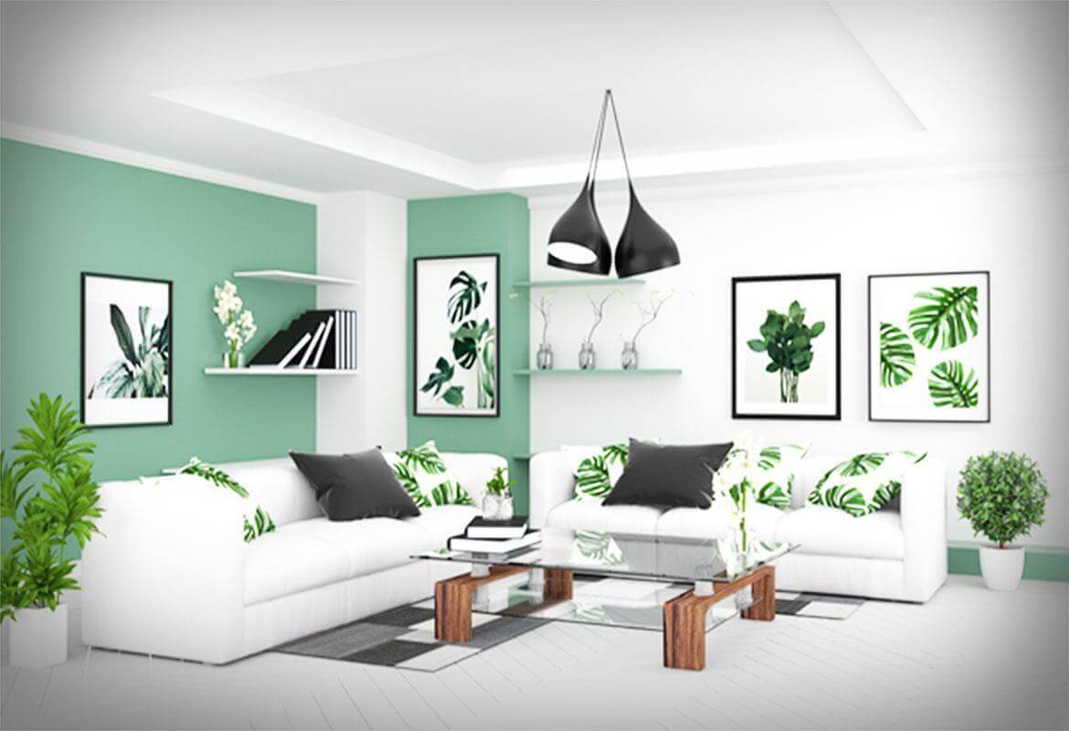 Phòng khách hiện đại với sofa trắng, gối lá, tranh treo tường xanh, và đèn treo thời trang.