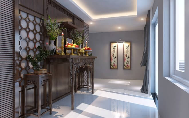 Phòng thờ sáng sủa, nội thất gỗ trang trí với bàn thờ truyền thống, hoa và trái cây, tranh treo tường nghệ thuật.