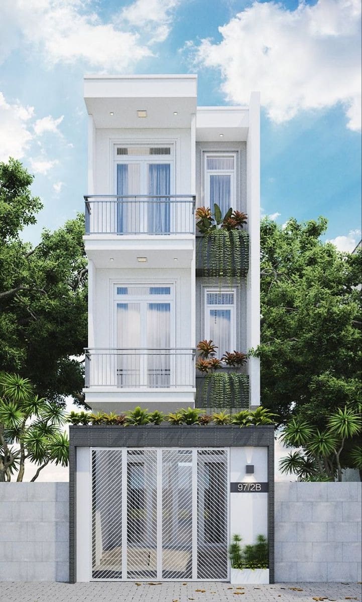 Nhà phố hiện đại ba tầng màu trắng, ban công thoáng mát và cây xanh xung quanh.