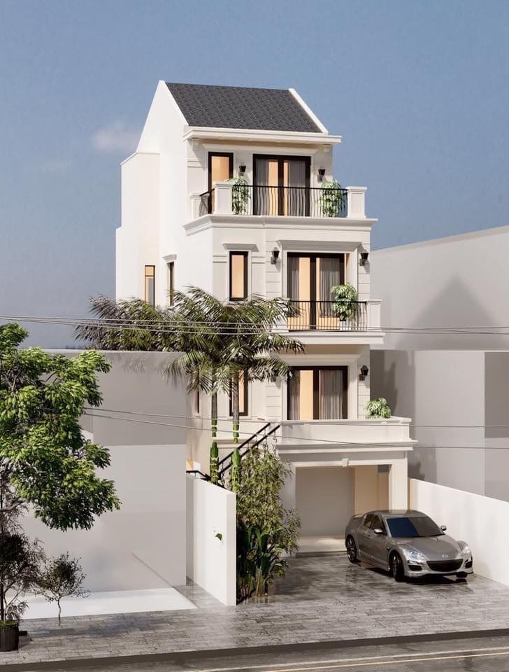 Nhà phố hiện đại 3 tầng màu trắng với garage, cửa sổ rộng, cây xanh trang trí và xe đỗ phía trước.
