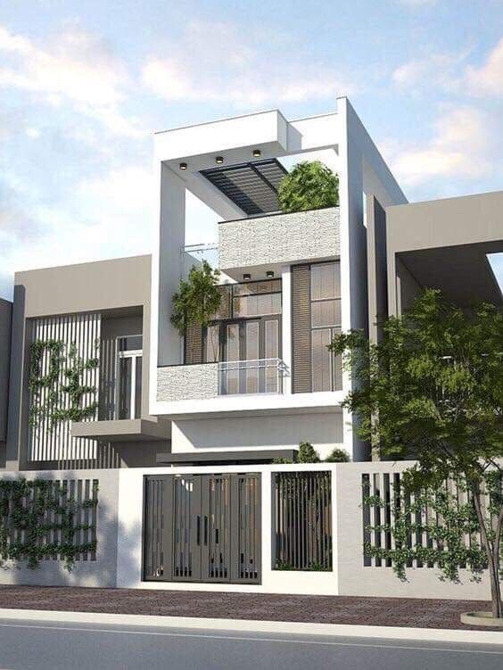 Nhà phố hiện đại với kiến trúc tối giản, có ban công và cây xanh xung quanh, bầu trời trong xanh.