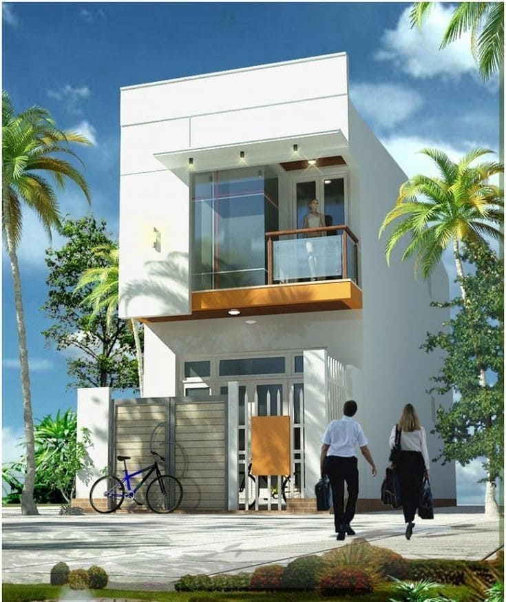 Ngôi nhà hiện đại hai tầng, có người đứng ban công và hai người đi bộ vào cổng, môi trường xung quanh có cây xanh.