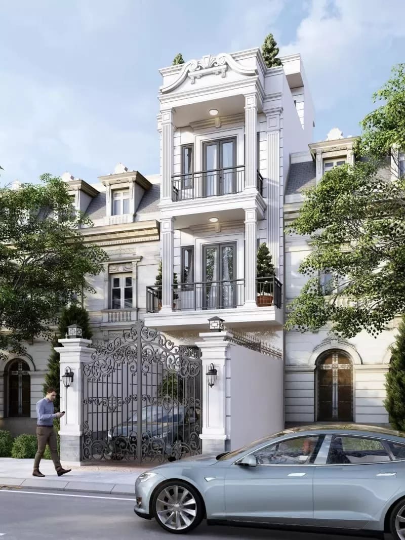 Biệt thự ba tầng phong cách cổ điển với cửa sắt trang trí, ô tô đậu phía trước và người đi bộ cạnh cổng.