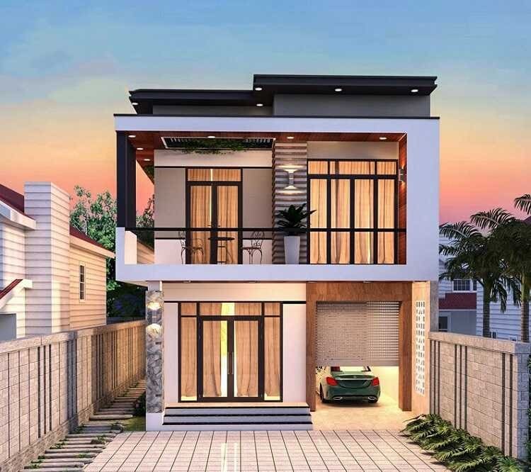 Nhà hiện đại hai tầng với gara, cửa kính lớn, và ban công rộng, dưới ánh hoàng hôn.