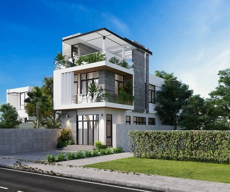 Ngôi nhà hiện đại ba tầng với cây xanh và sân vườn, nằm ở khu dân cư yên tĩnh vào ngày trời xanh.