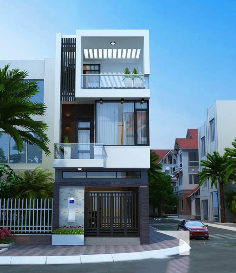 Nhà phố hiện đại 3 tầng với ban công, cây xanh, và cửa kính lớn, nằm trên con đường có ô tô và cây cọ.