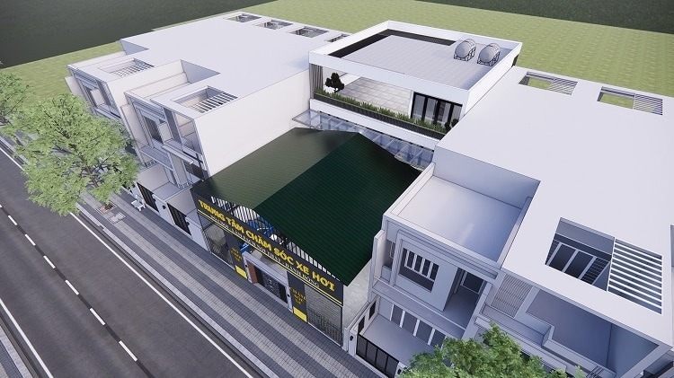 Tòa nhà cao tầng hiện đại với mặt tiền xanh, giao lộ nhộn nhịp, cây xanh ven đường.