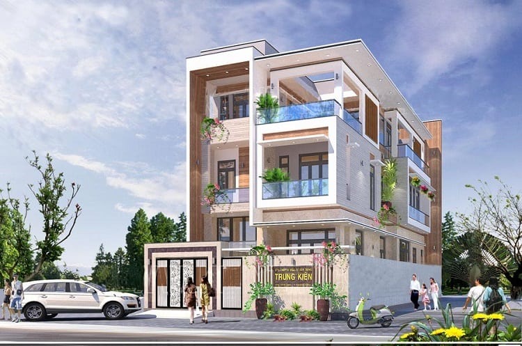 Nhà phố hiện đại ba tầng, thiết kế cửa kính và ban công rộng với cây xanh, ô tô đỗ phía trước trên đường phố.