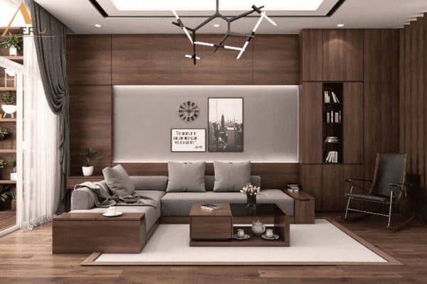 Phòng khách sang trọng với nội thất gỗ hiện đại, ghế sofa xám và đèn chùm thiết kế độc đáo.