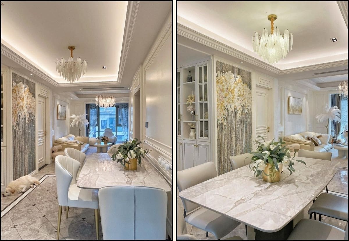 Phòng khách và ăn sáng hiện đại với đèn chùm sang trọng, hoa trang trí trên bàn và ghế sofa êm ái.