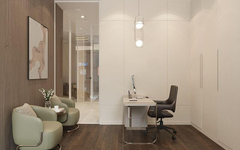 Văn phòng hiện đại với ghế sofa xanh, bàn làm việc gọn gàng và đèn treo, tạo không gian làm việc thoải mái.