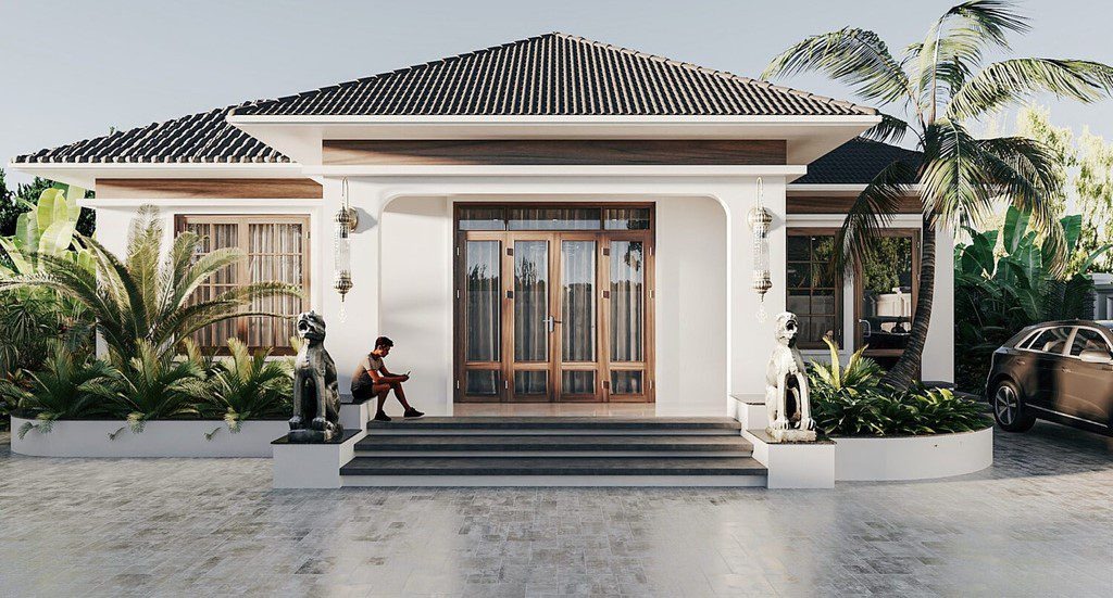 Ngôi nhà mái ngói hiện đại, sân trước rộng rãi với cây cọ, có một người đang ngồi bên ngoài.